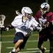 Skyline's Zach Schwartz handles the ball in the game against Okemos on Tuesday, April 9. AnnArbor.com I Daniel Brenner